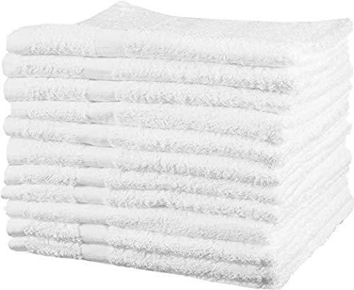 a white bed with a white blanket on it