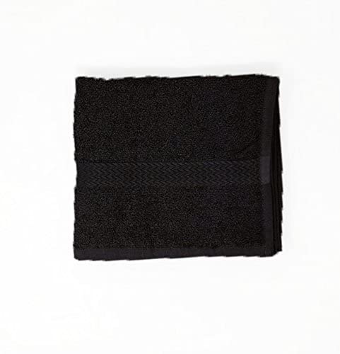 a black piece of luggage sitting on top of a white surface