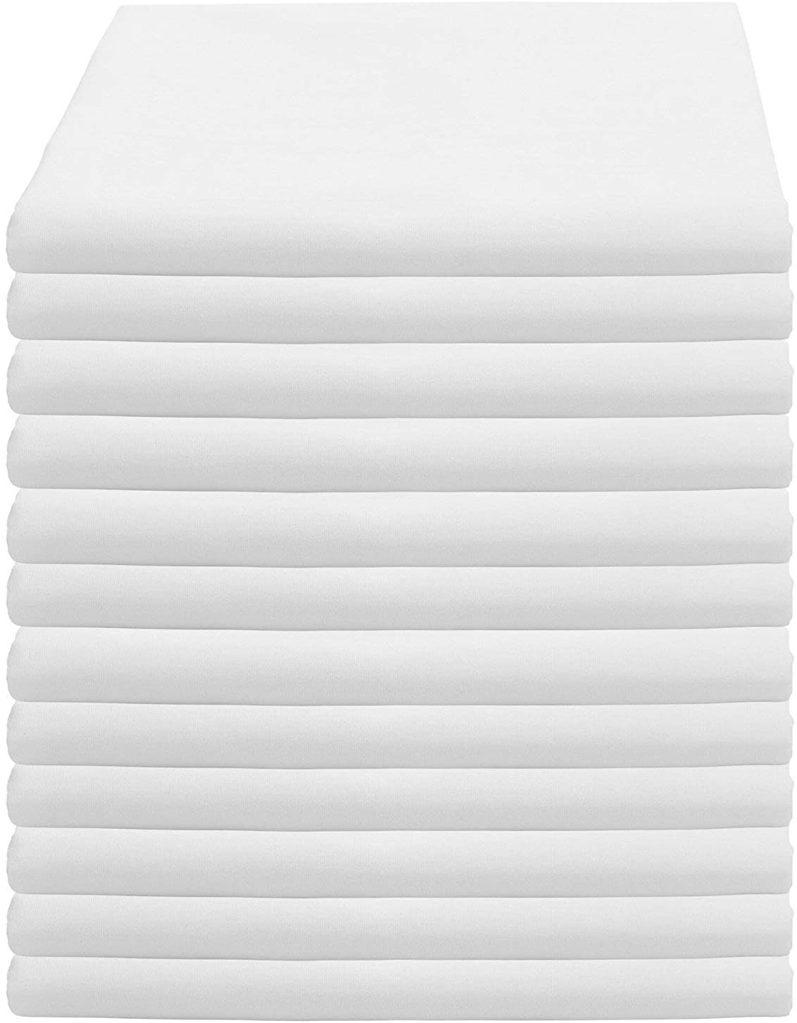 a white bed with white sheets and a white background
