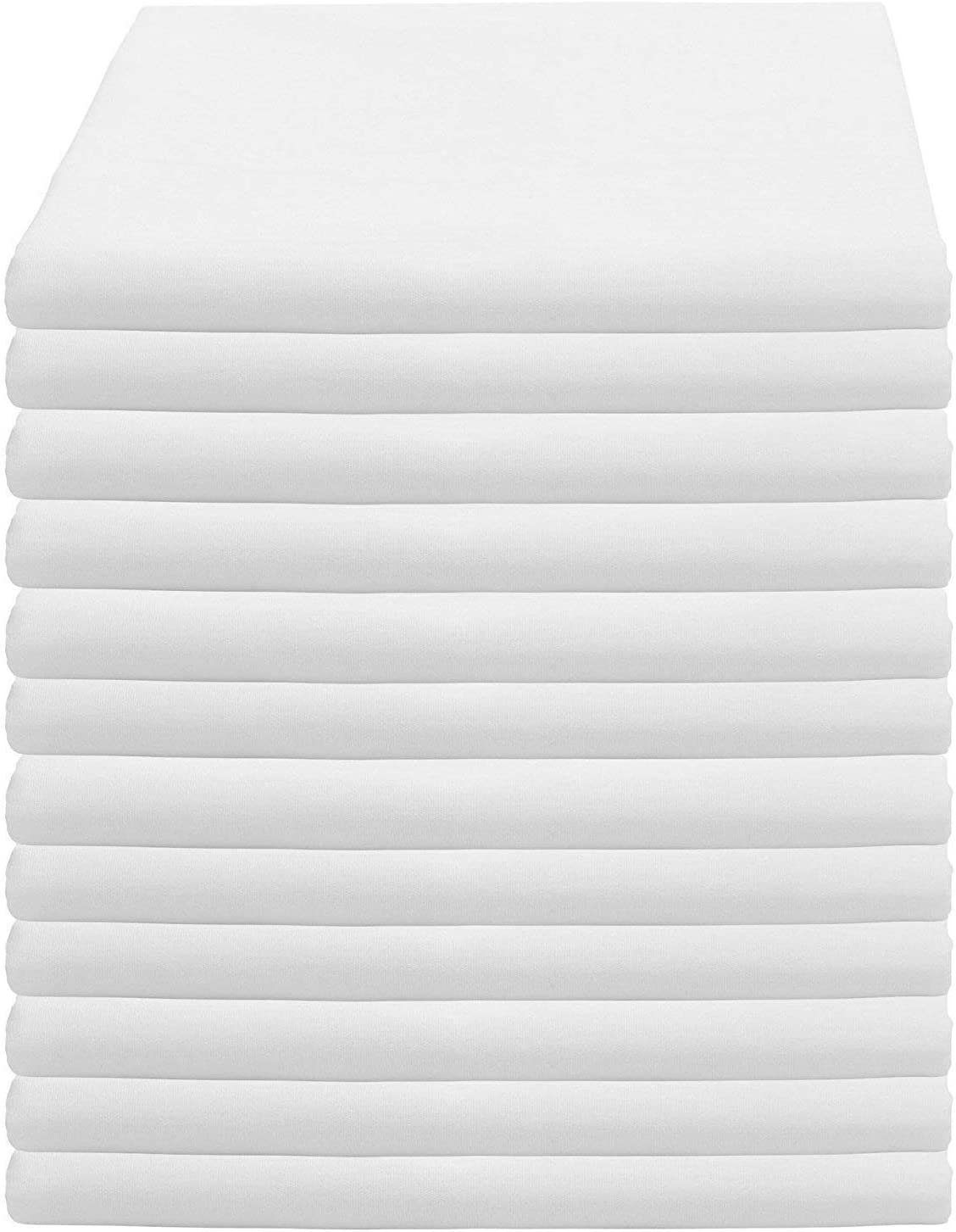 a white bed with white sheets and a white background