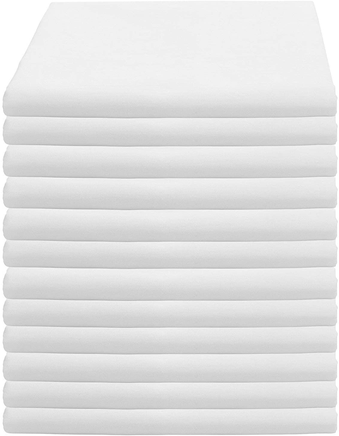 a white bed with white sheets and a white background
