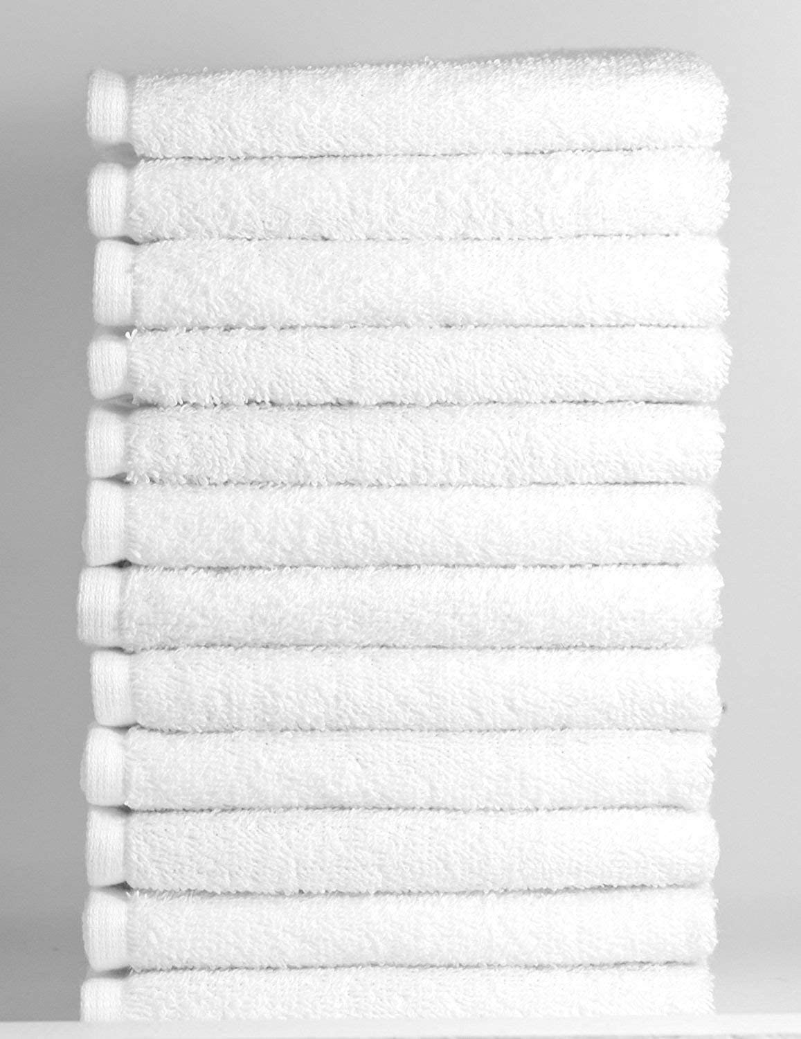 a white bed with a white blanket on it